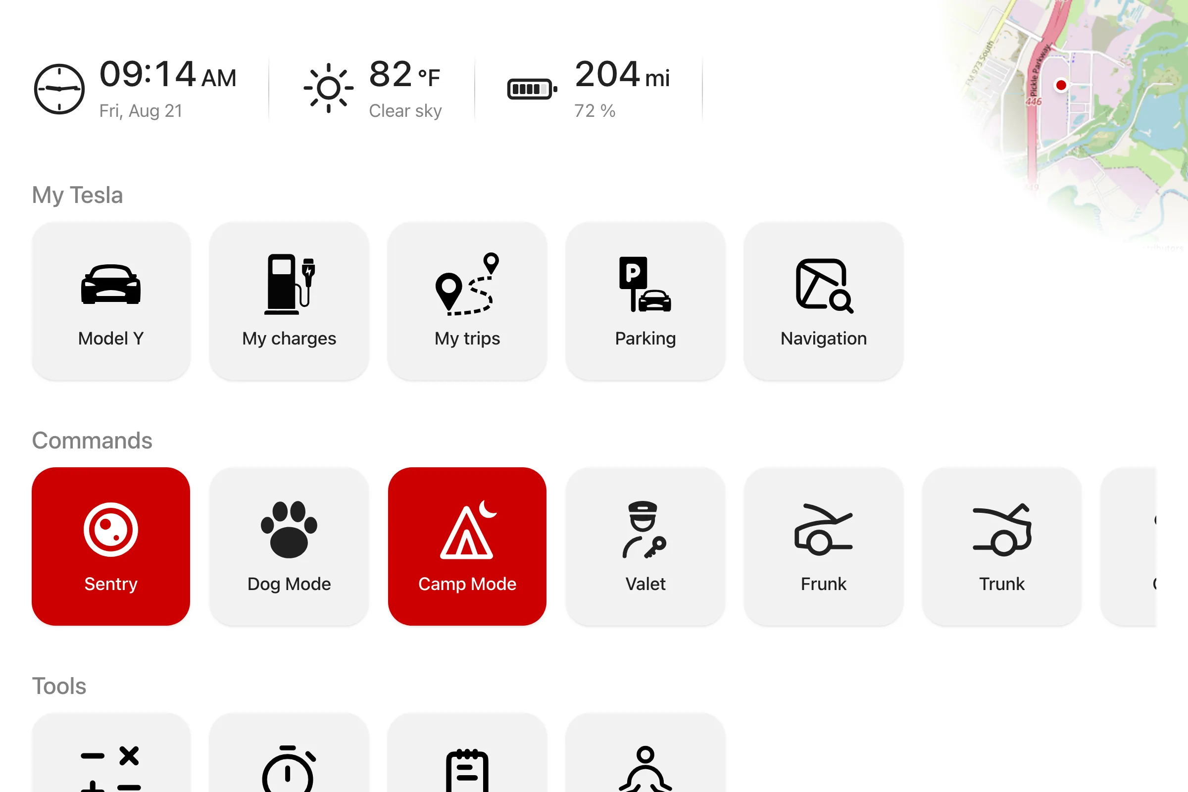 The iCar home screen in a Tesla: time, weather, range and a grid of favourites as large tiles